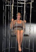 girl on swing in go go cage